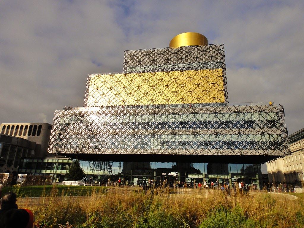 The filigree metal facade and gold rotunda of the Library of Birmingham